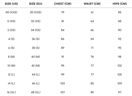 Robe midi Marguerite en satin à pois noirs et blancs, dos nu et bretelles.